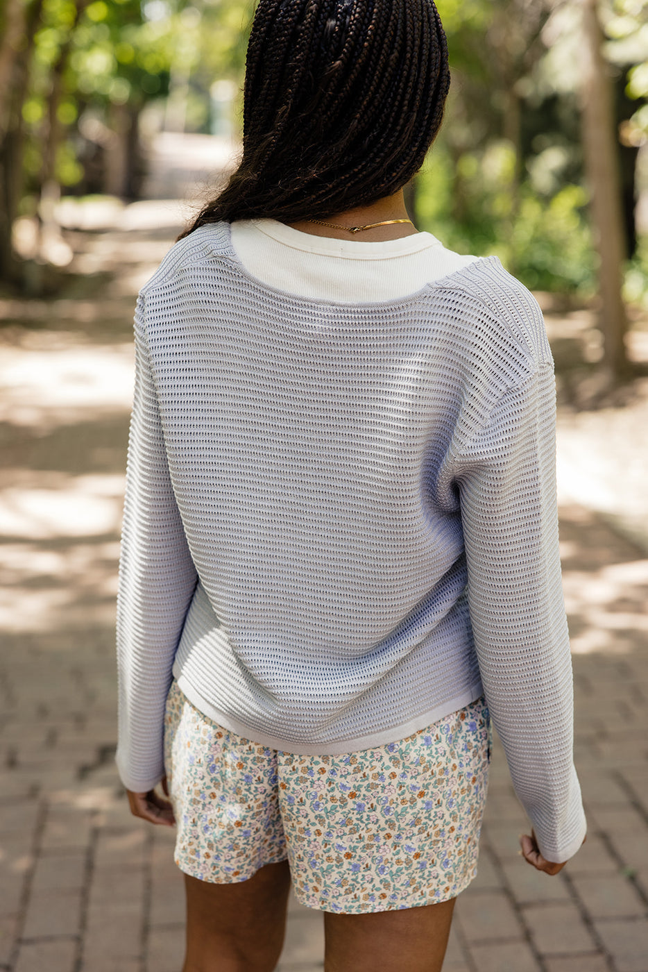 a woman walking down a path