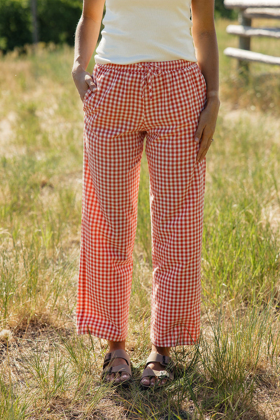 a person wearing red and white checkered pants