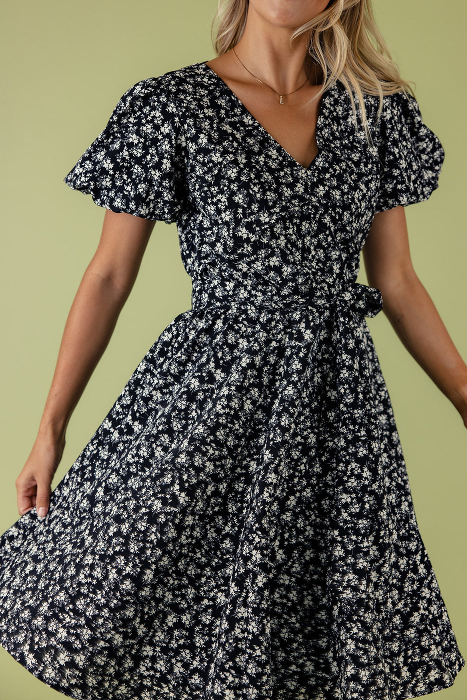 a woman wearing a floral dress