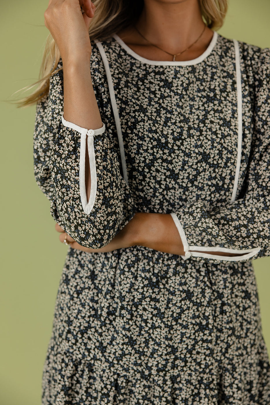 a woman wearing a floral dress