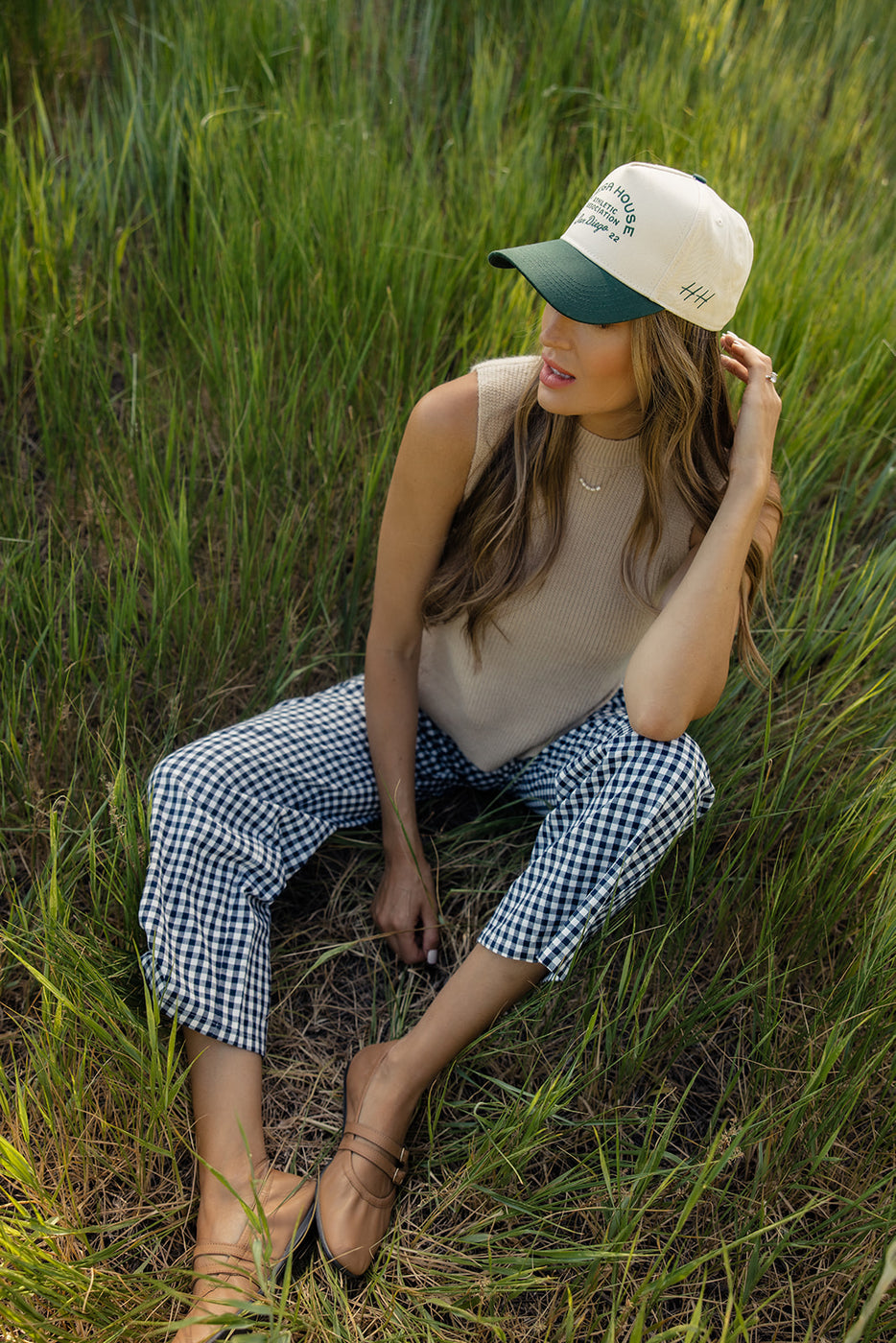 a woman sitting in a field