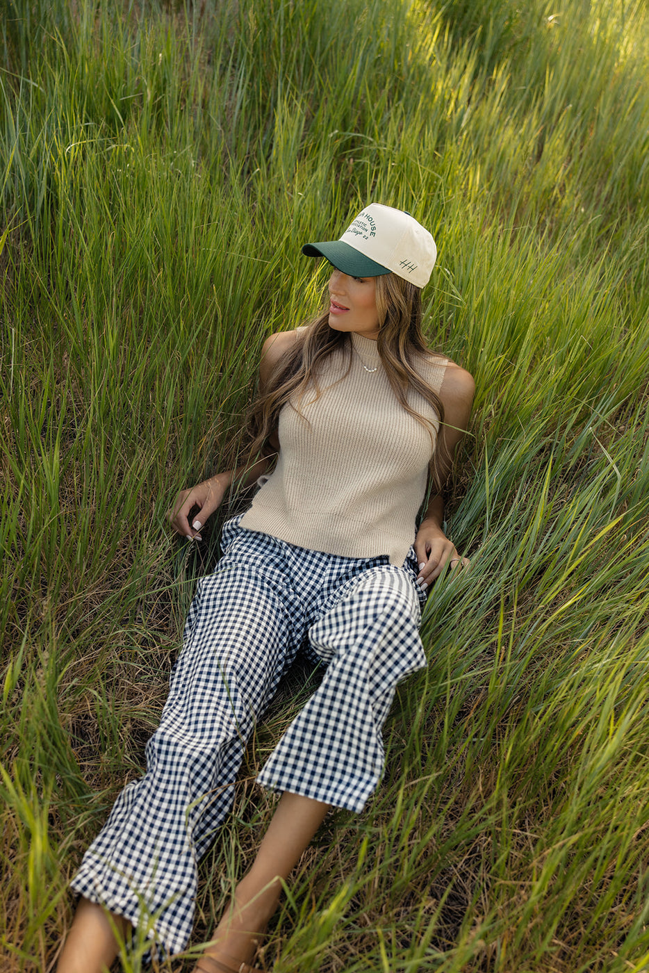 a woman lying in tall grass