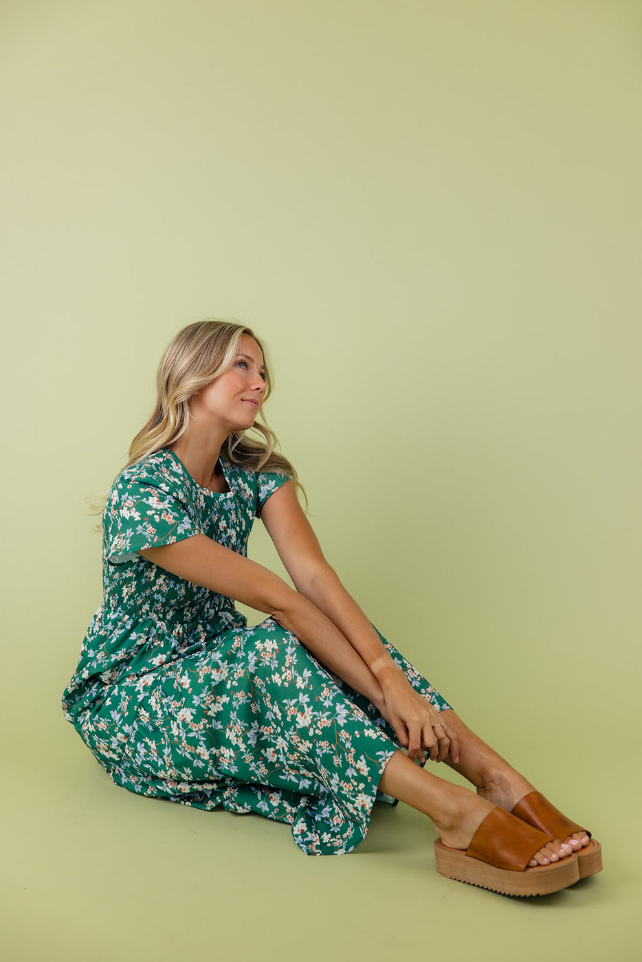 a woman sitting on the floor