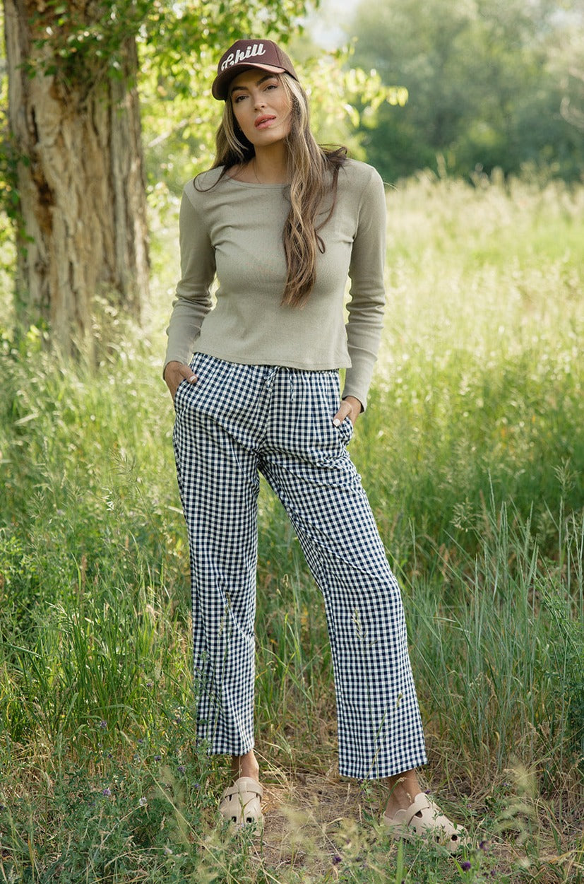 a woman standing in tall grass