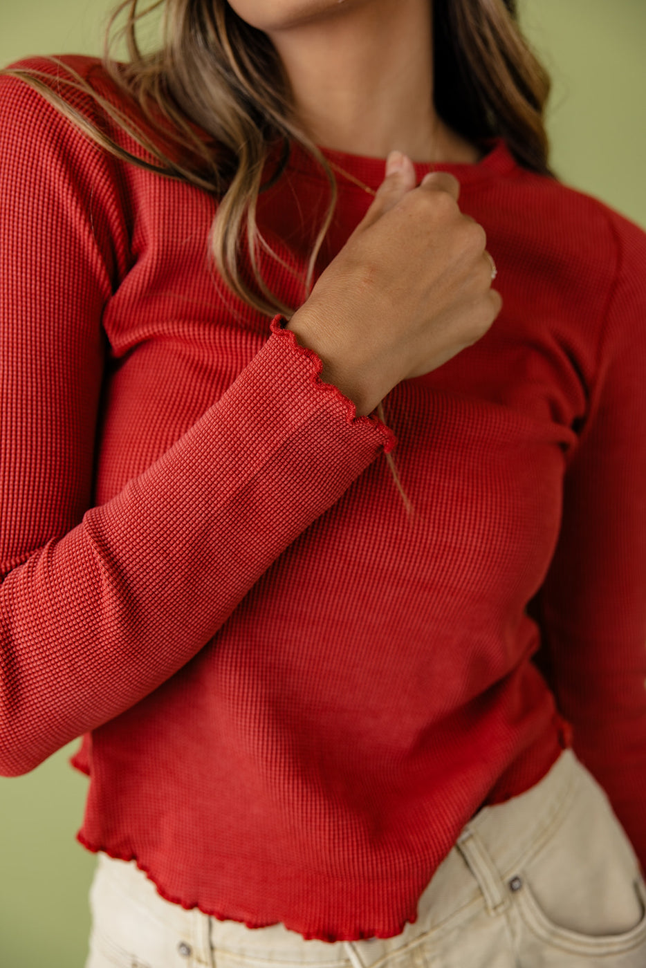 a woman wearing a red shirt