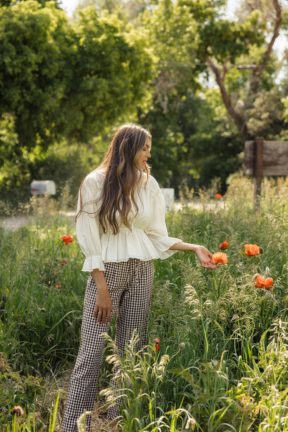 a woman in a field of flowers