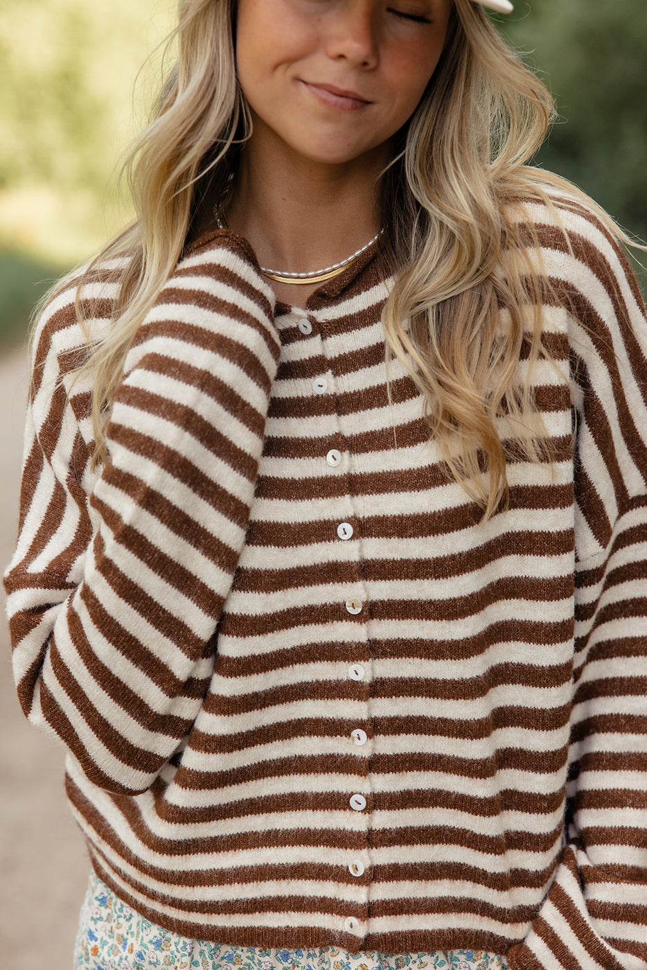 a woman wearing a striped sweater