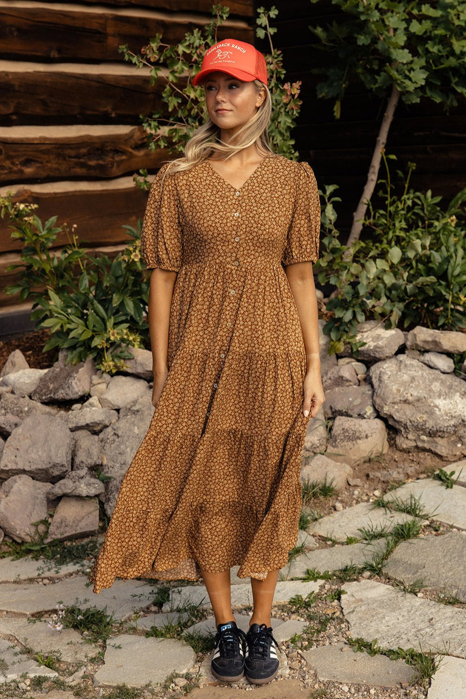 a woman in a brown dress