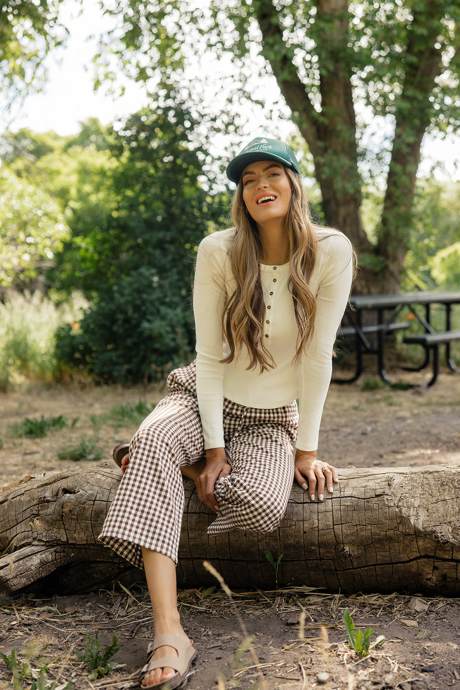 a woman sitting on a log