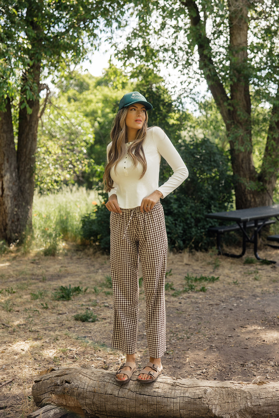 a woman standing in a park