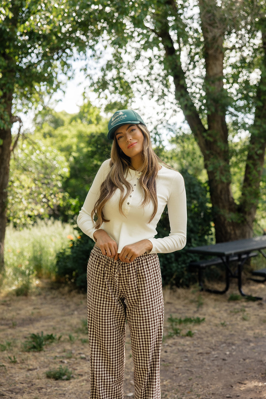 a woman in a green hat