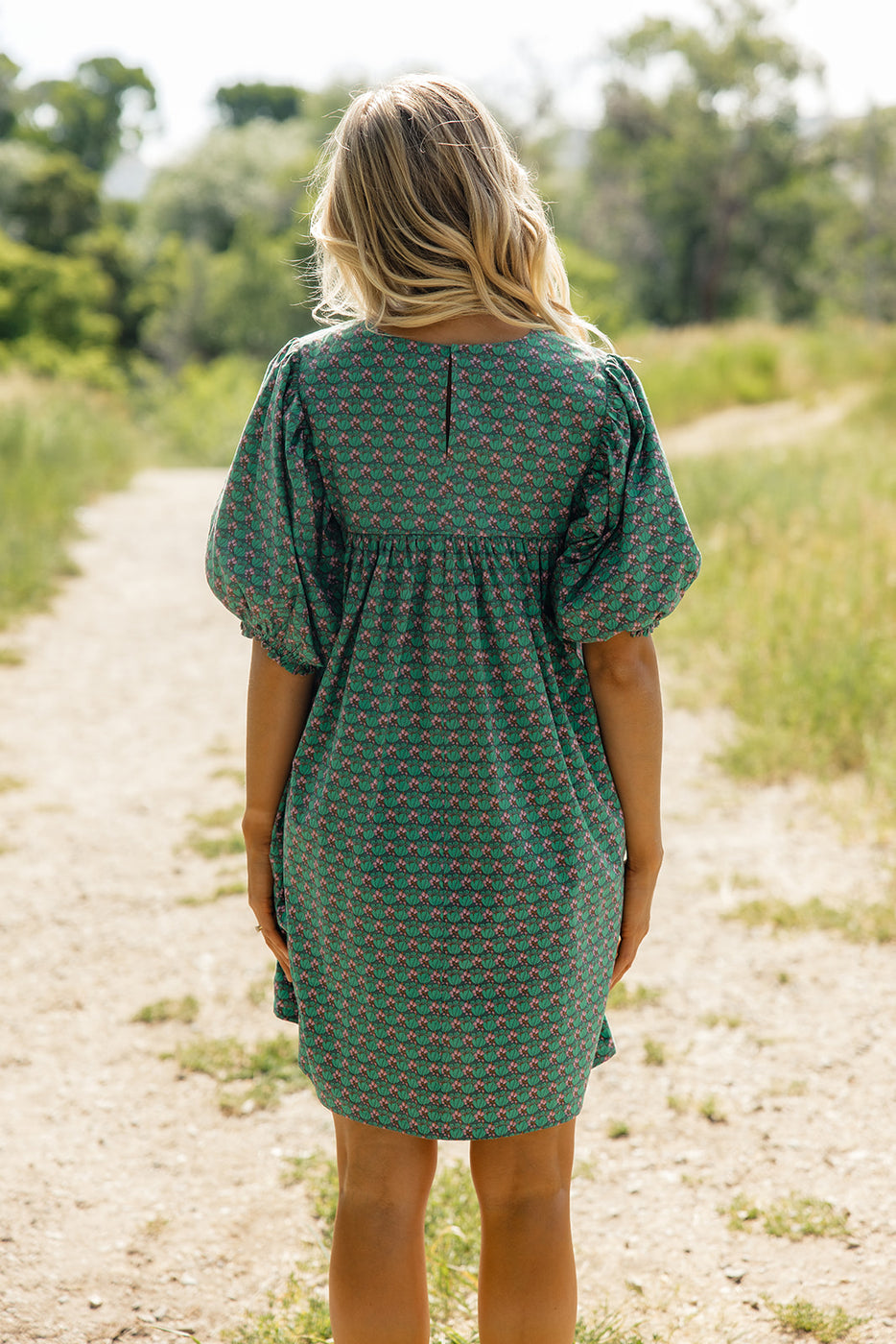 a woman in a green dress