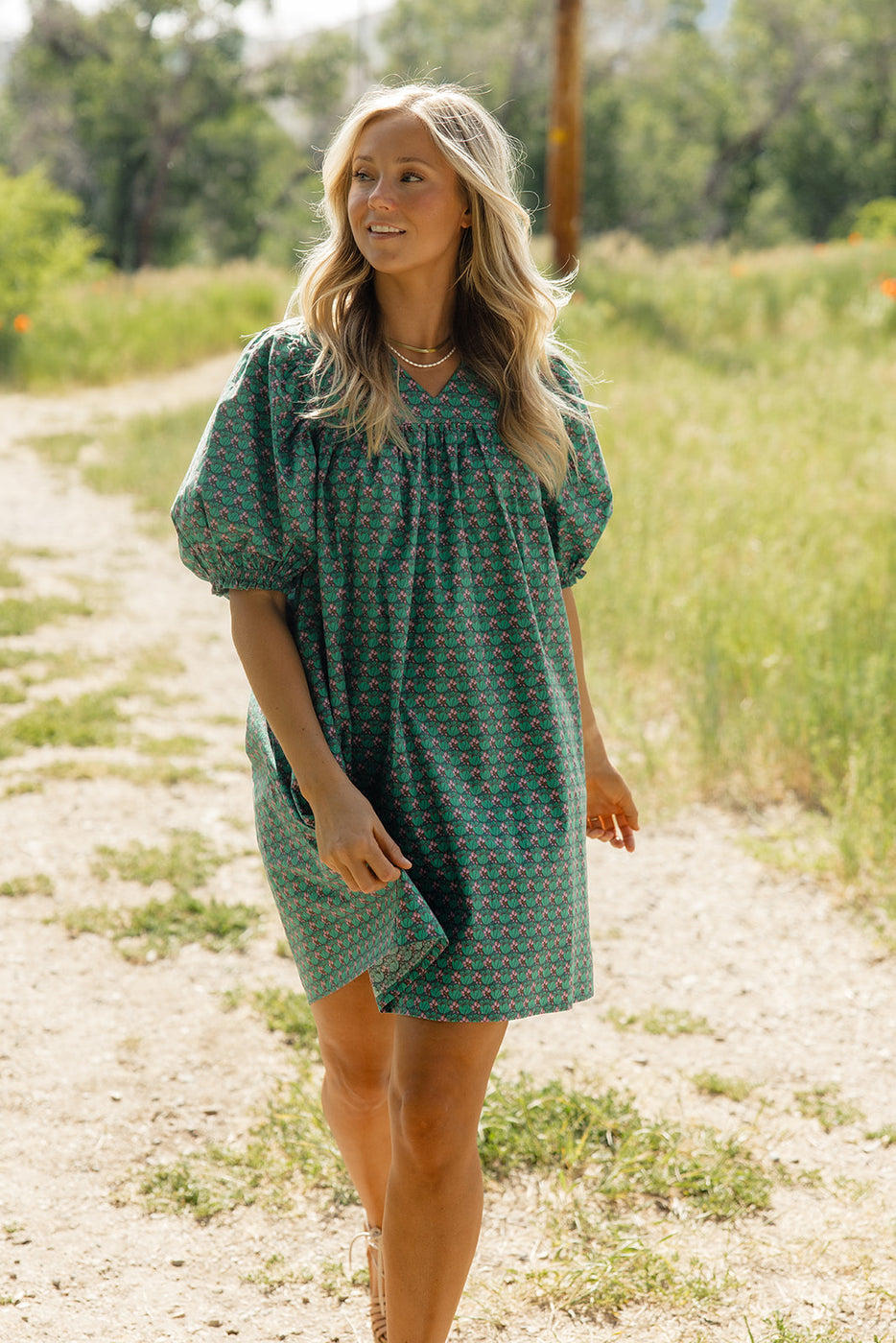 a woman in a green dress