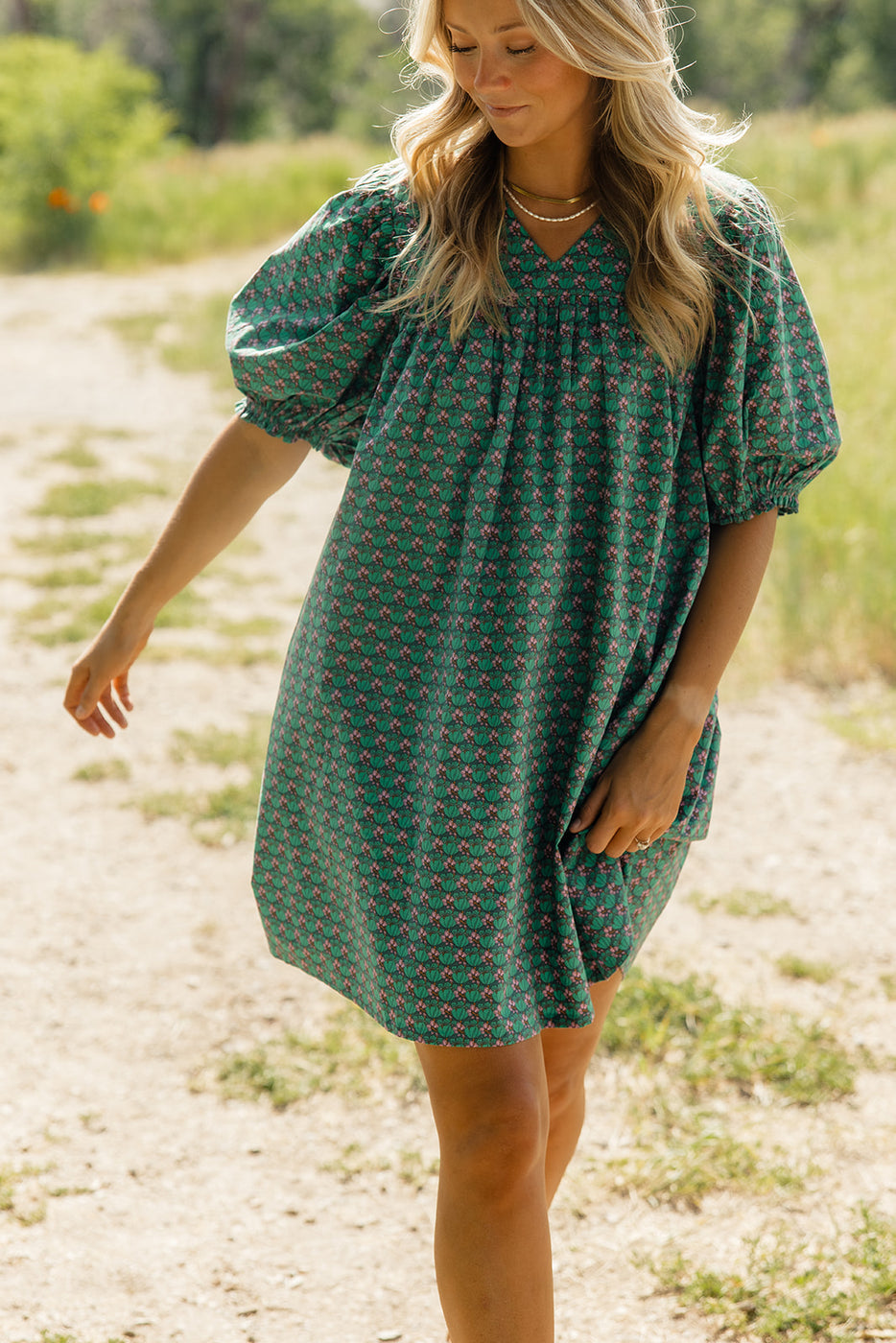 a woman wearing a green dress