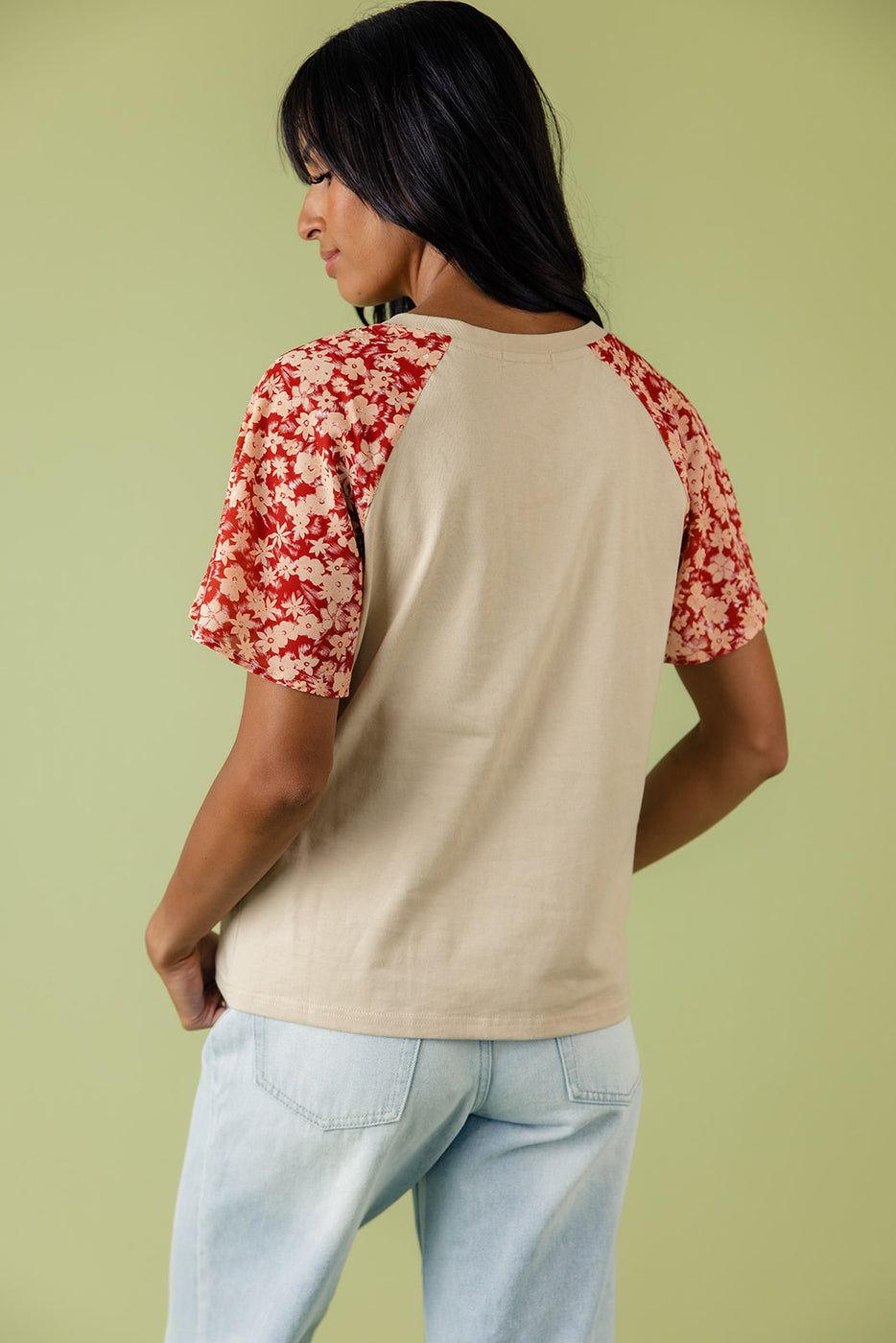 a woman wearing a red and white shirt