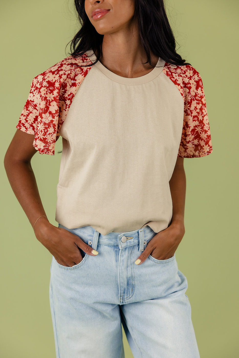 a woman wearing a red and white shirt