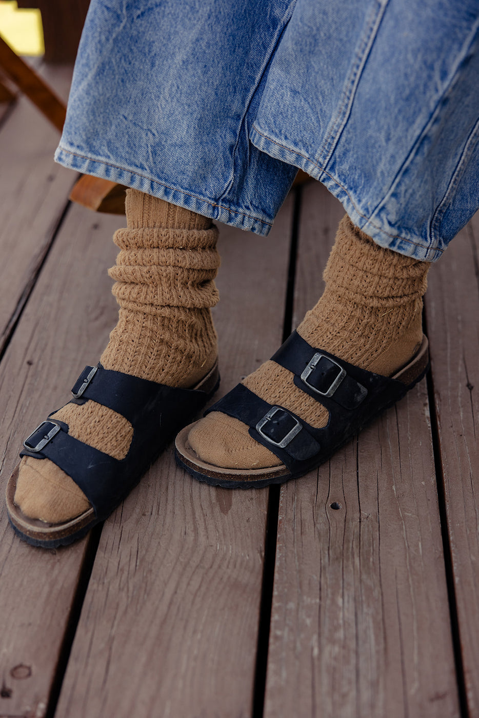 a person wearing sandals and socks