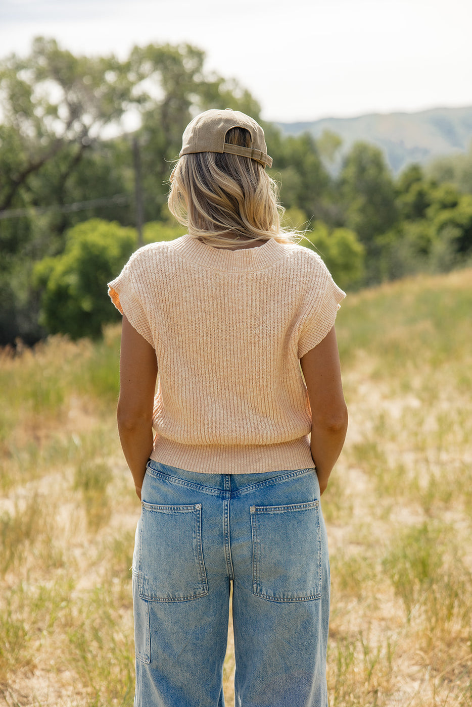 a woman standing in a field