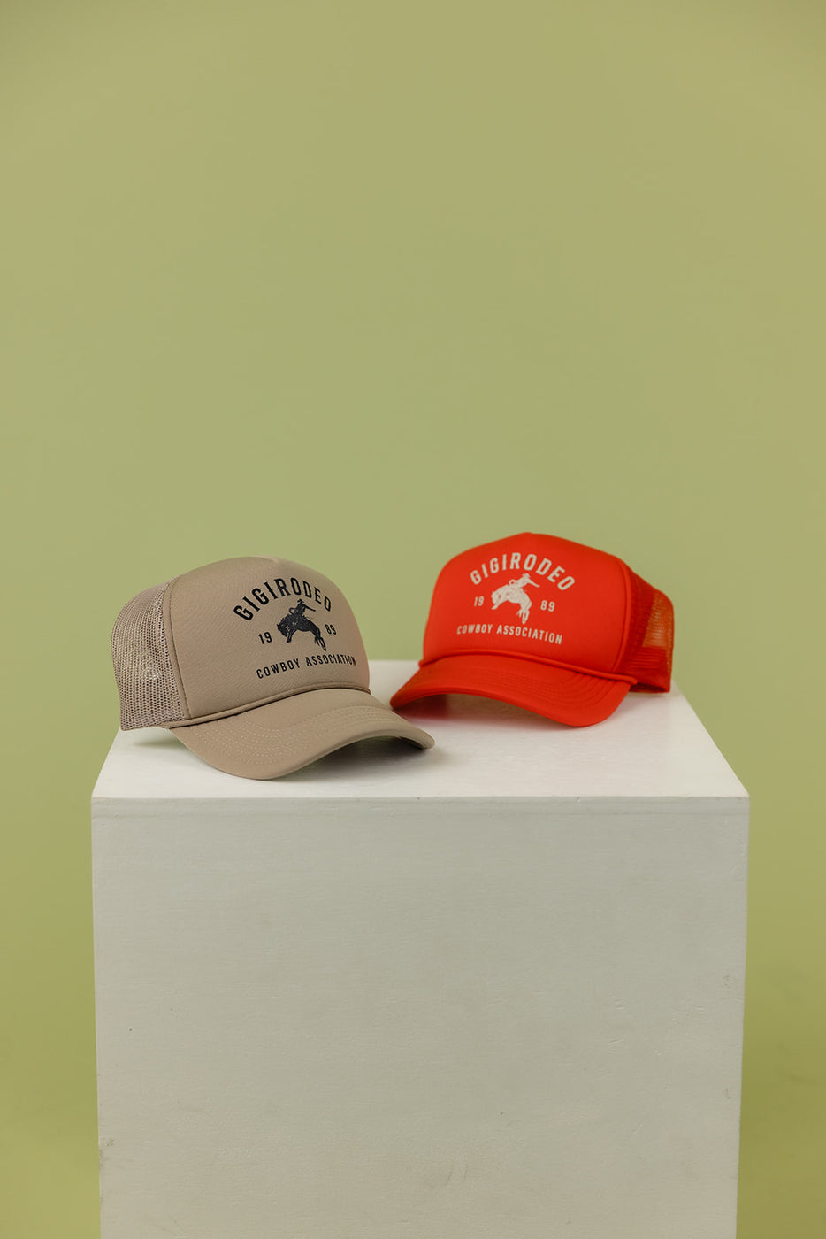 a pair of hats on a white box