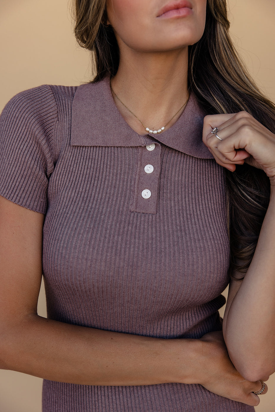 a woman wearing a purple shirt