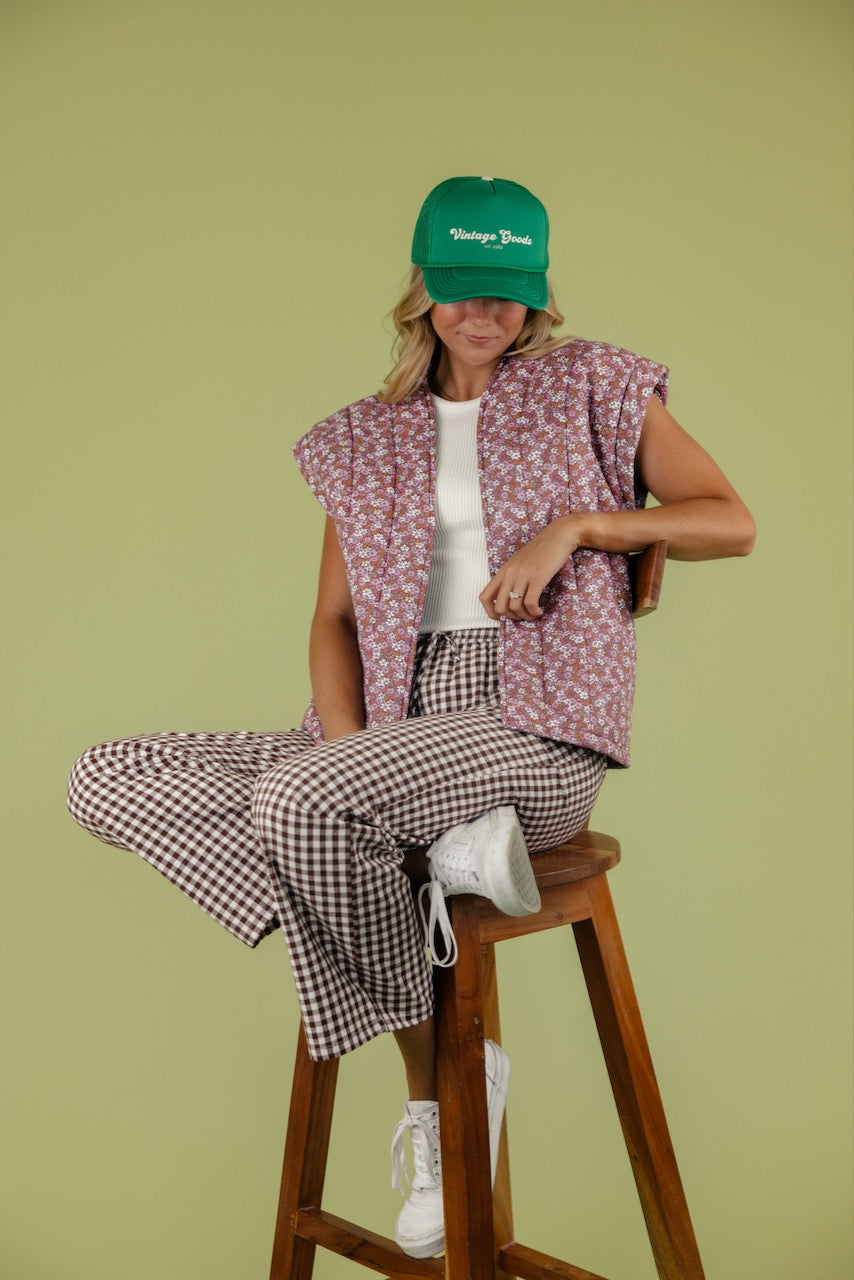 a woman sitting on a stool