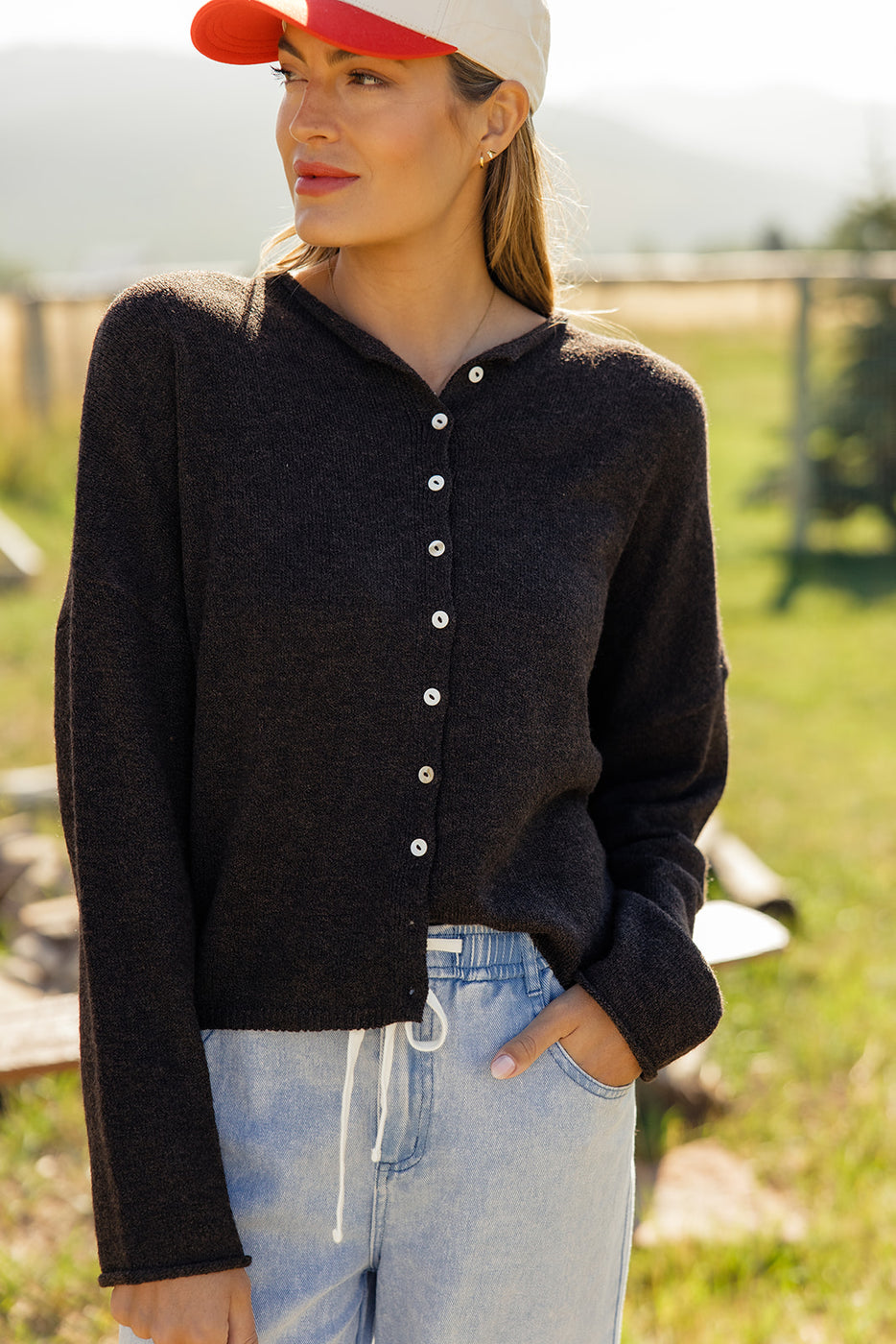 a woman wearing a black sweater