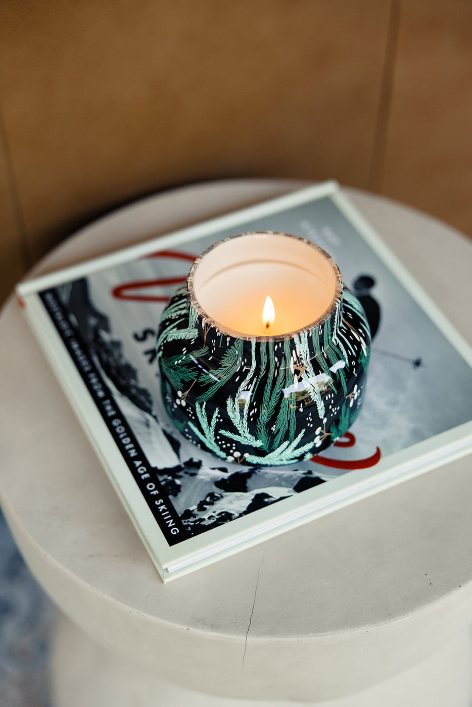 a candle on a book