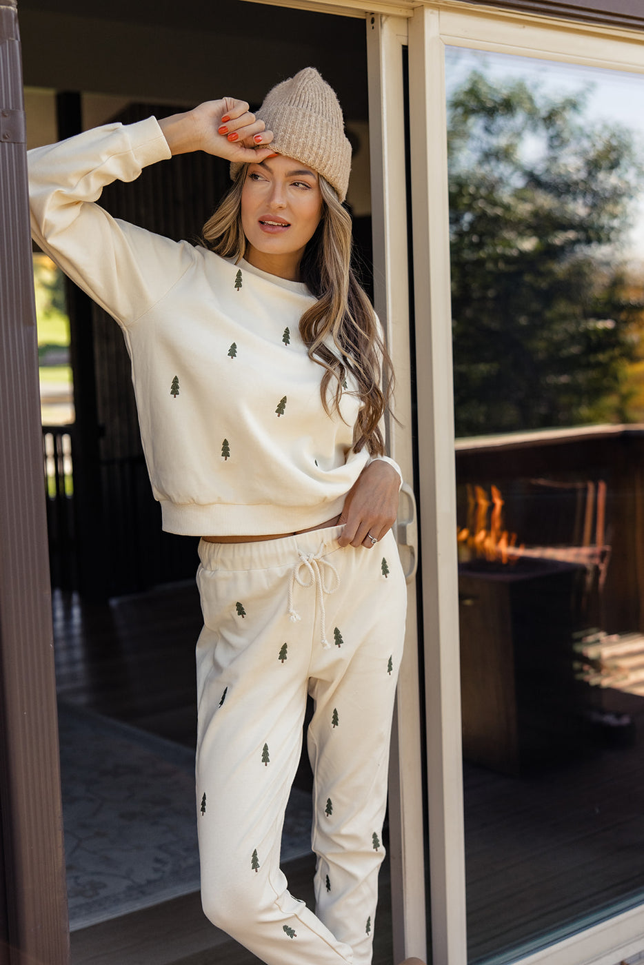 a woman wearing a hat and sweater