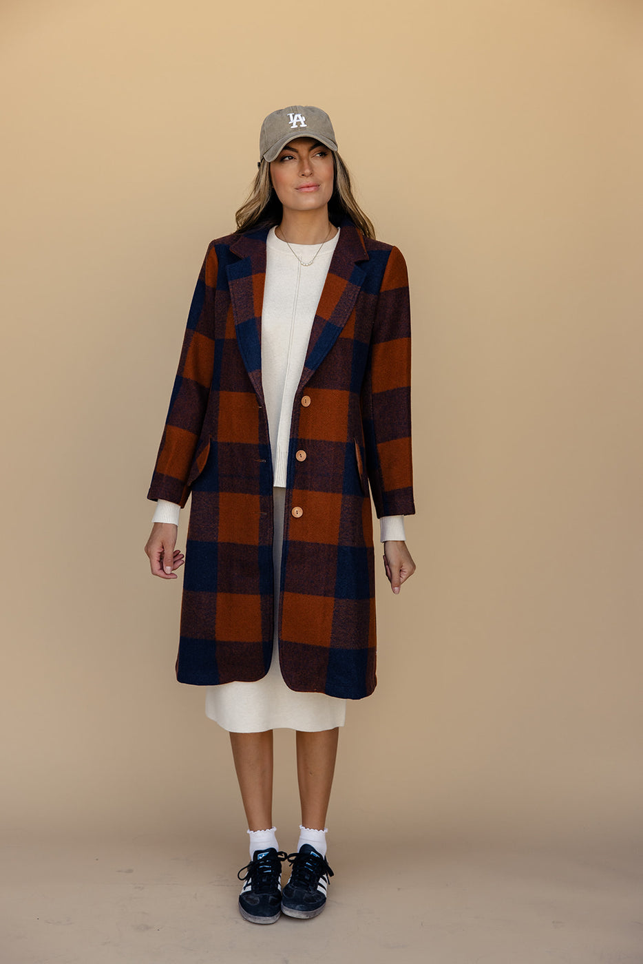 a woman in a plaid coat