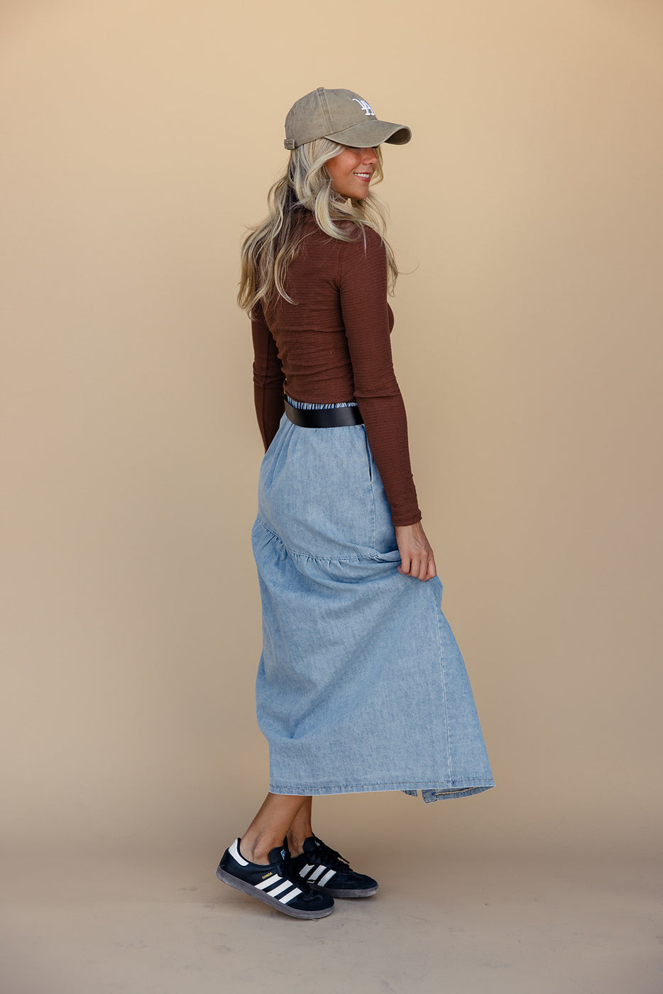 a woman in a long blue skirt