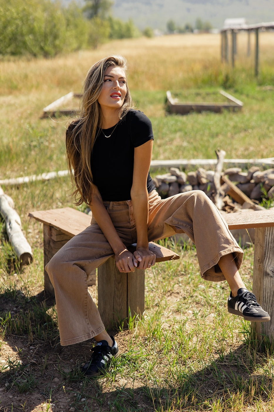 a woman sitting on a bench