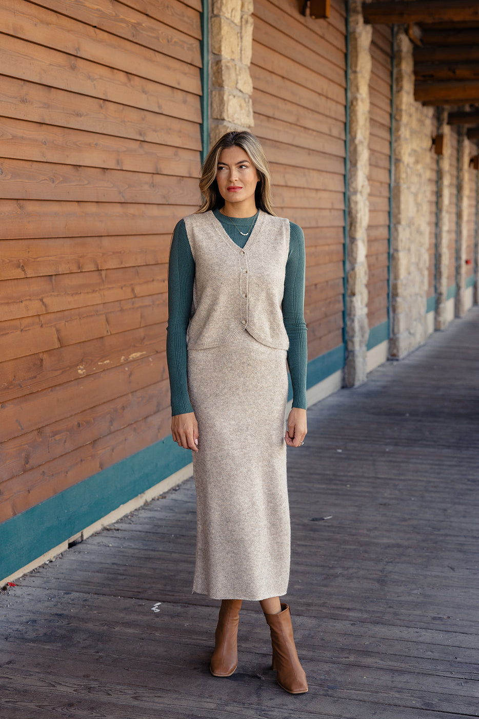 a woman standing in front of a building