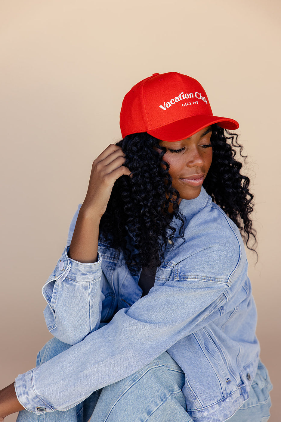 a woman wearing a red hat