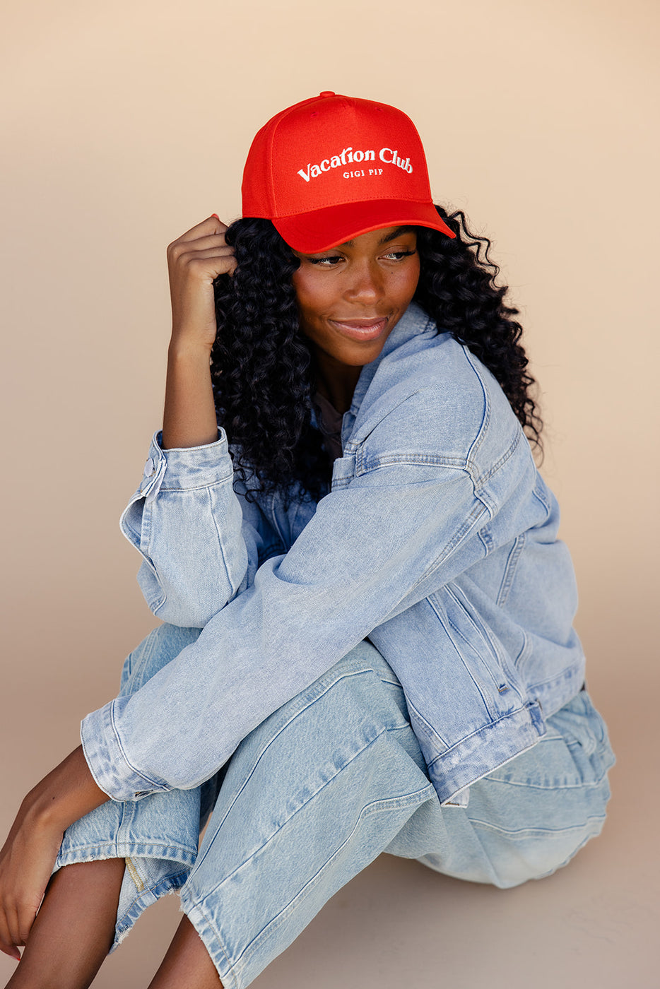 a woman wearing a red hat