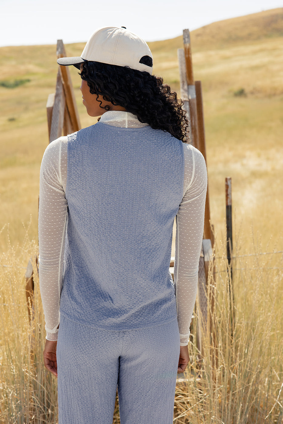 a woman standing in a field