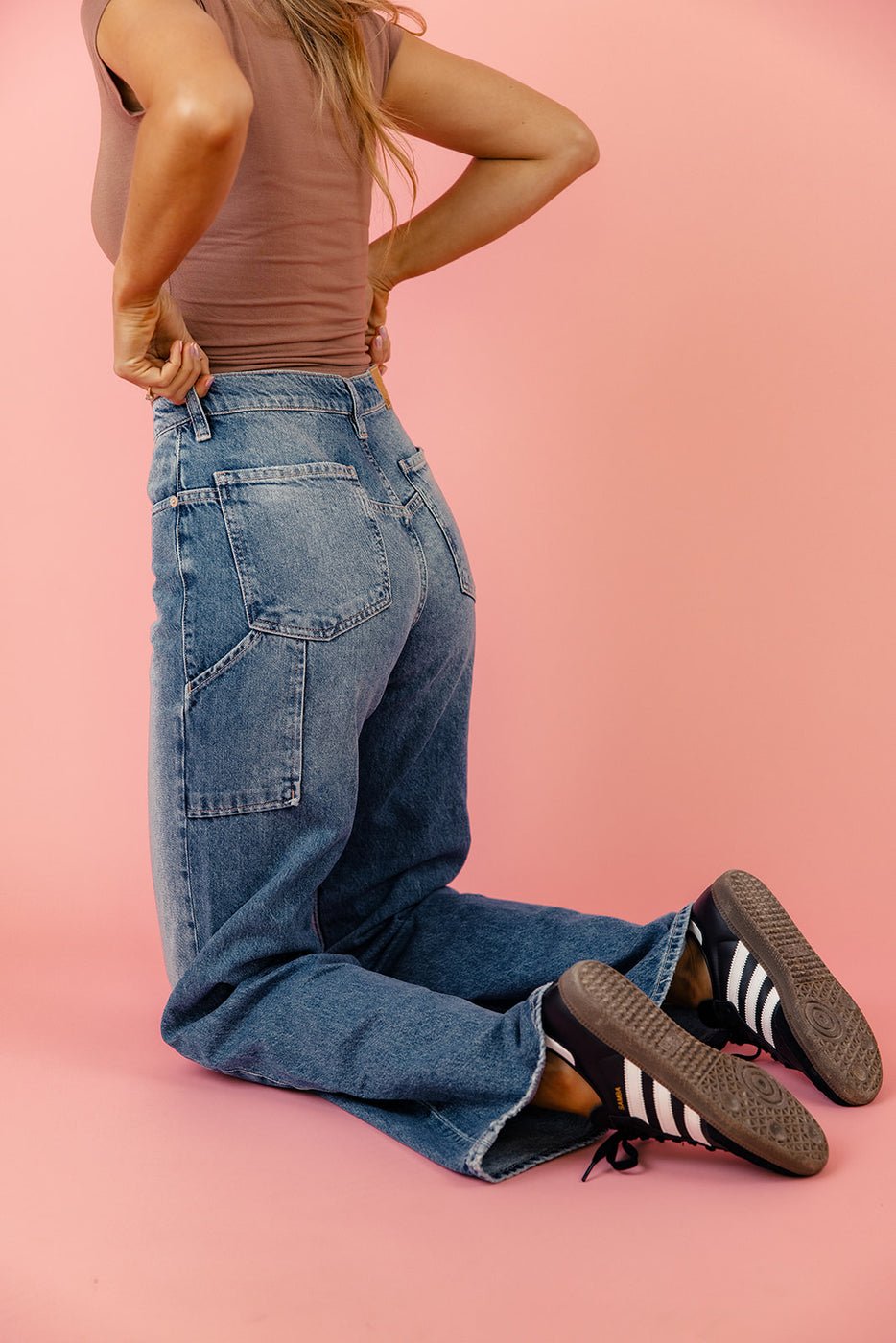 a person in jeans and shoes