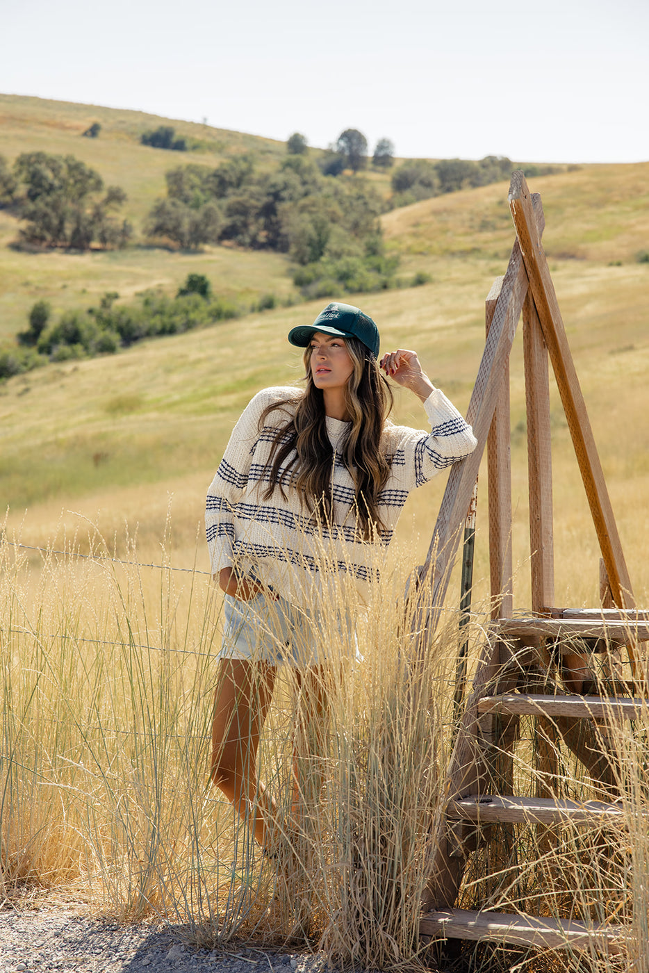 a woman standing in a field