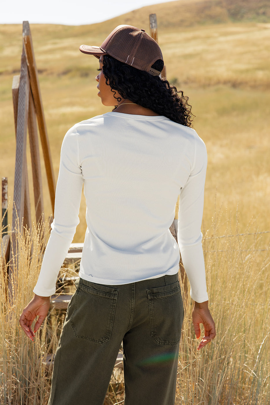 a woman standing in a field