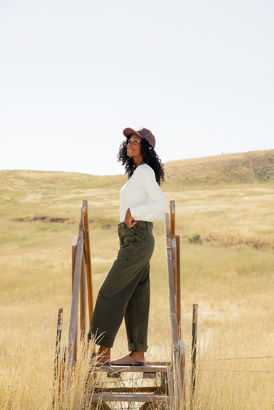 a woman standing in a field