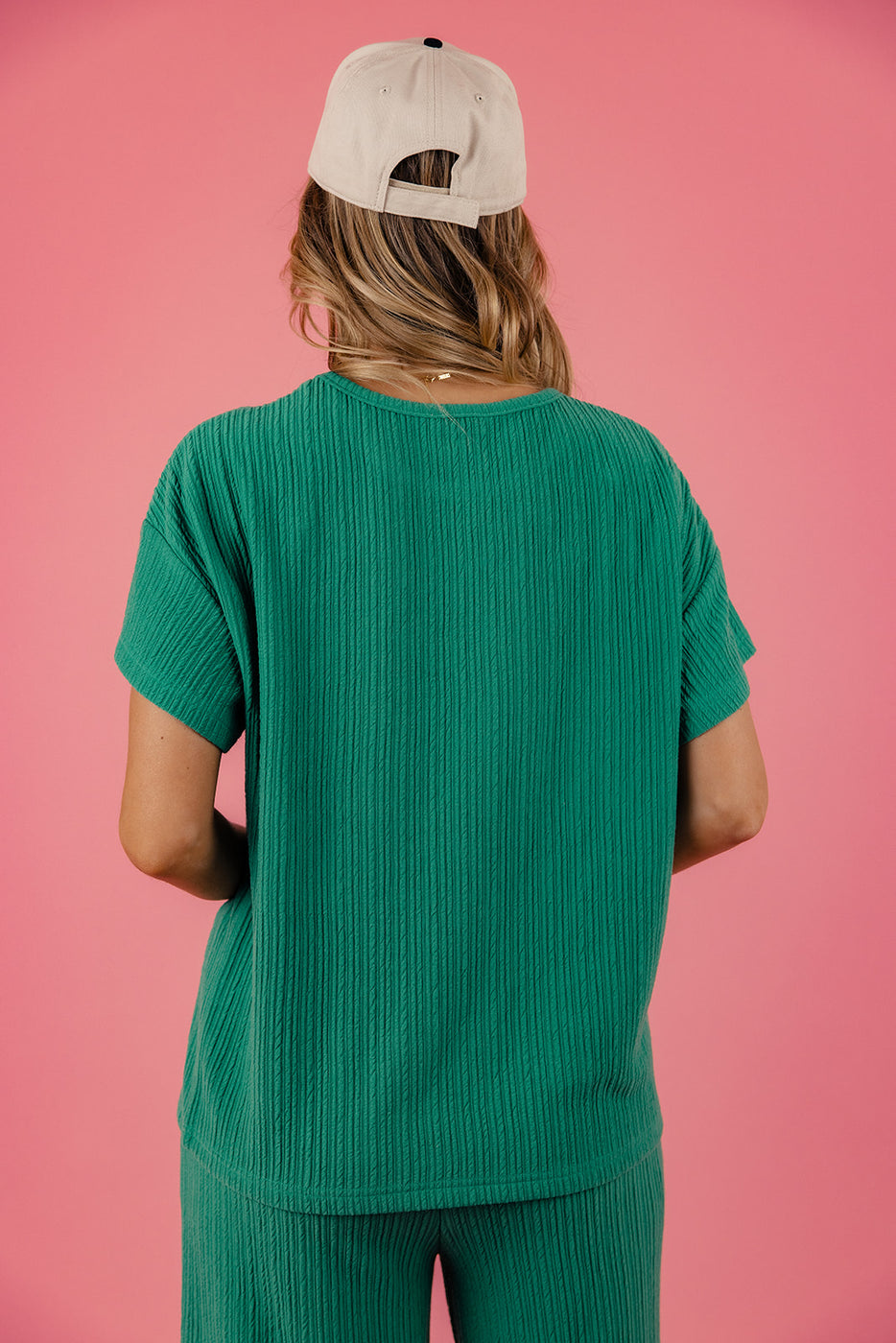 a woman in a green shirt