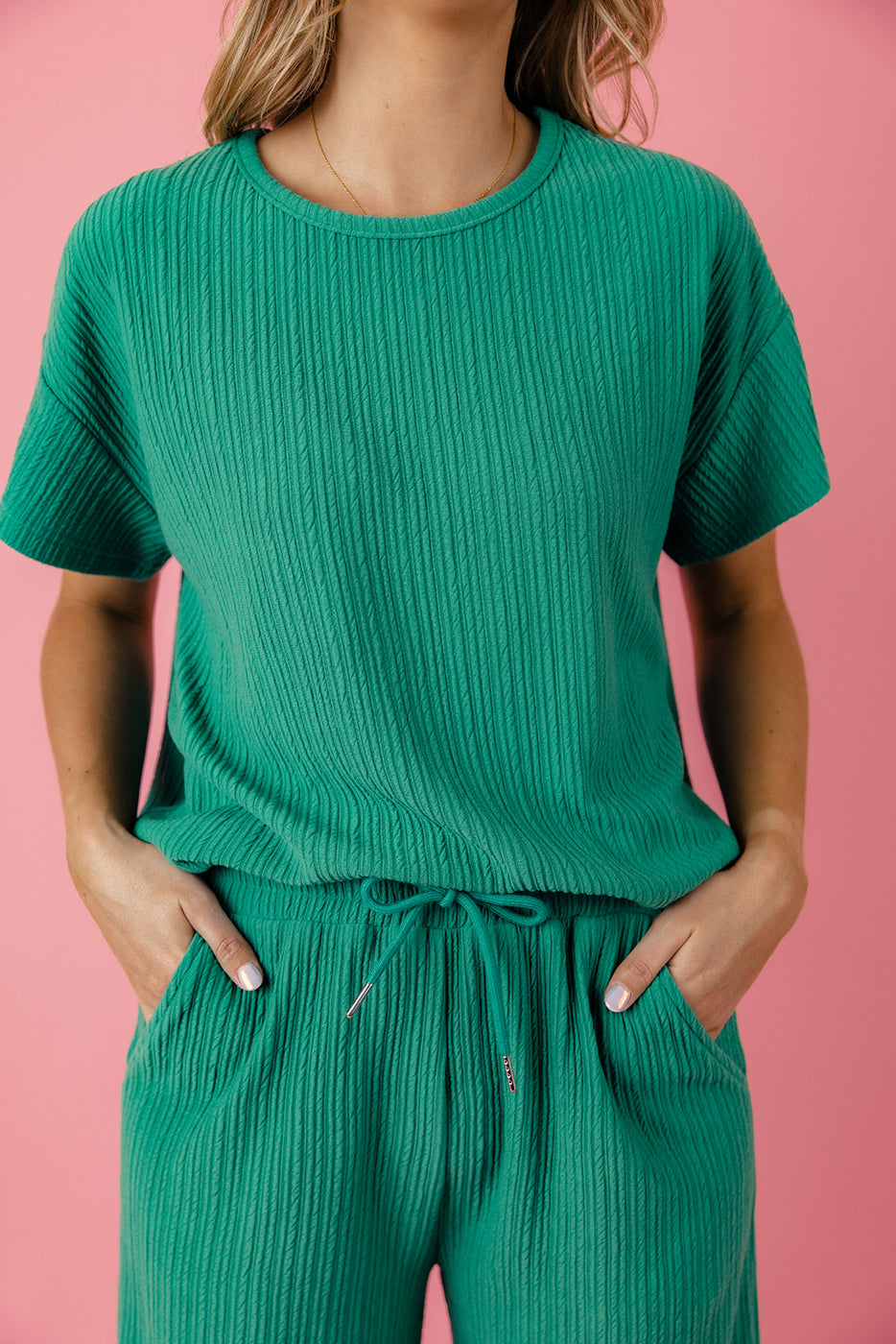 a person wearing a green outfit