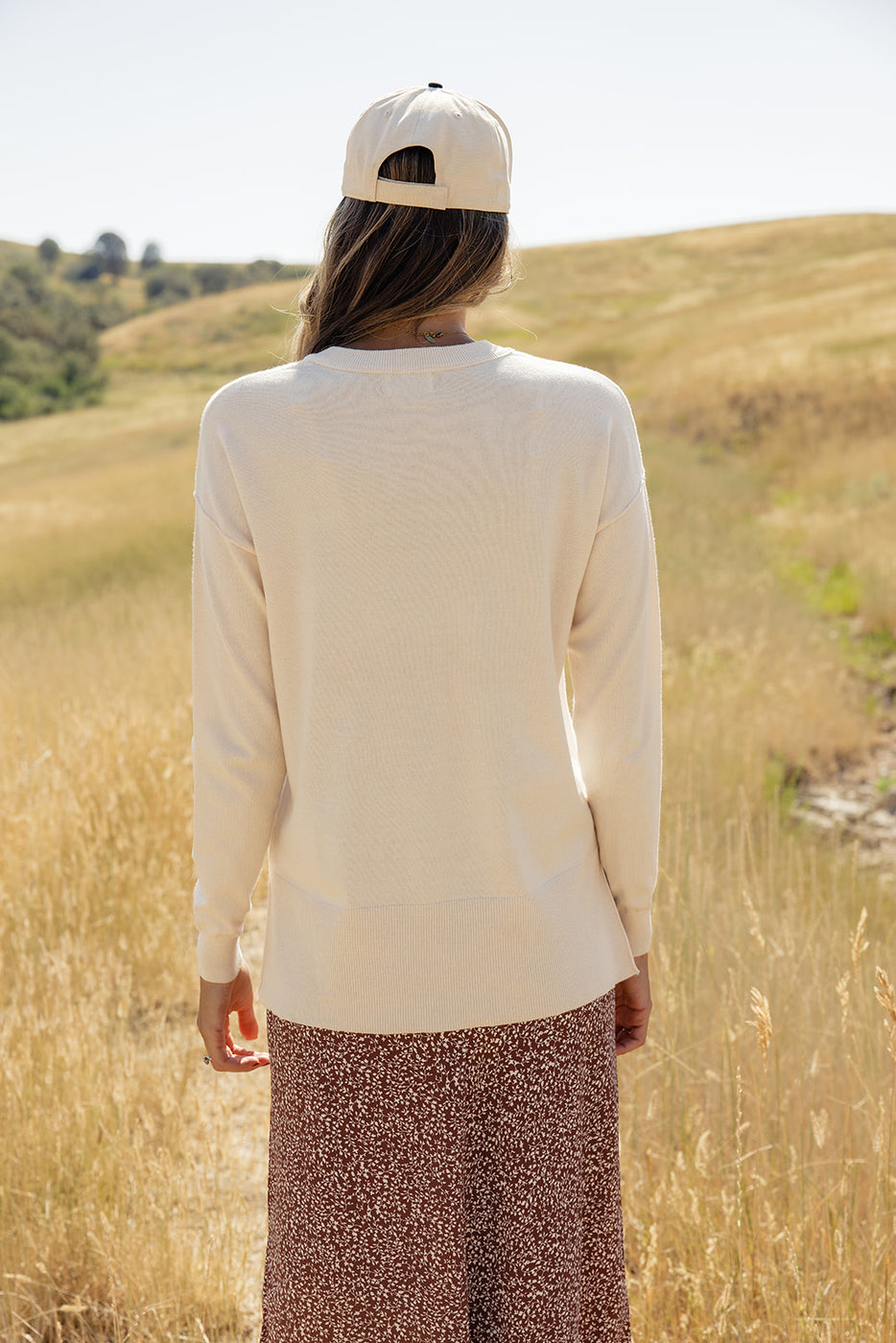 a woman standing in a field