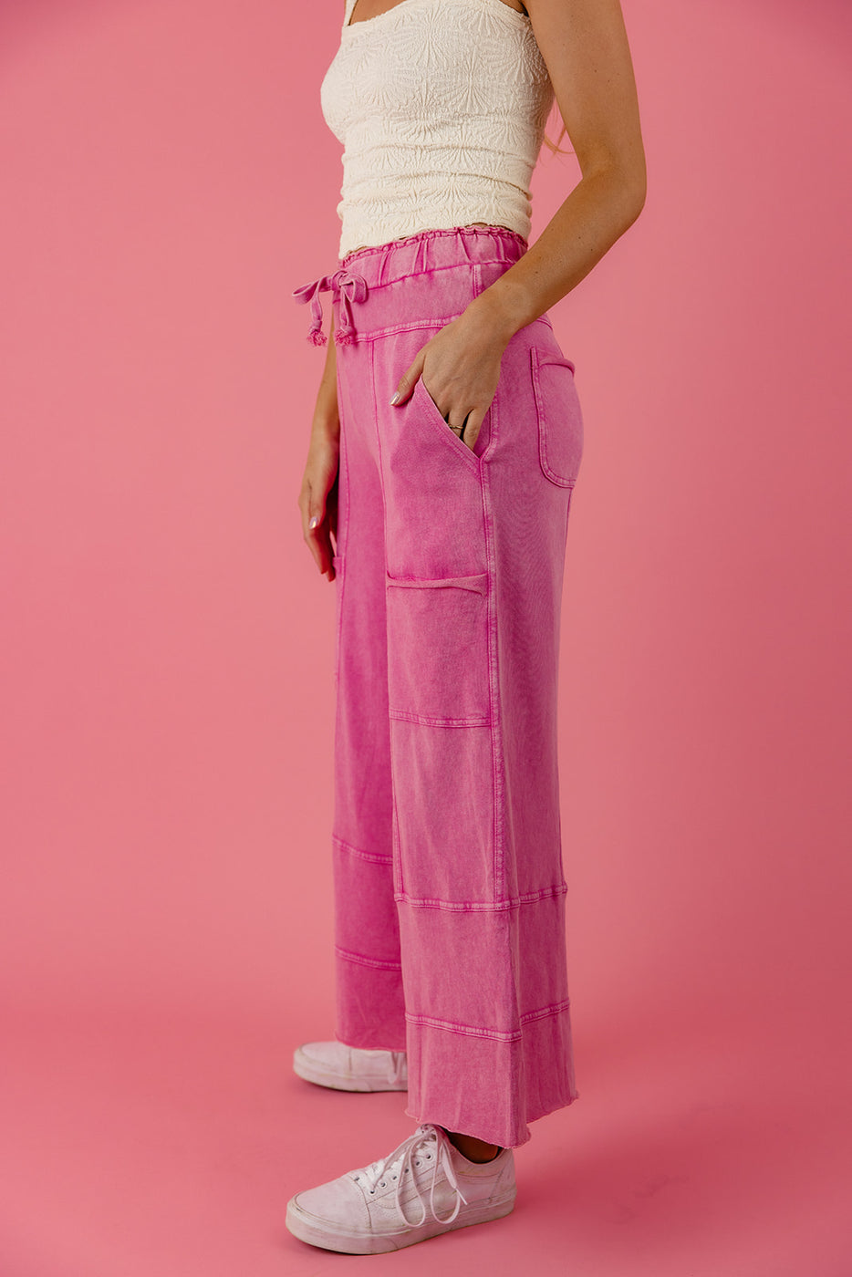 a woman wearing pink pants