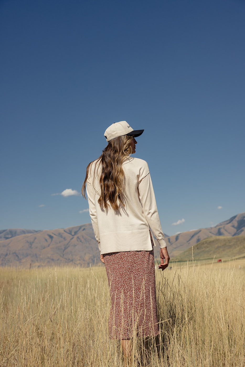 a woman standing in a field