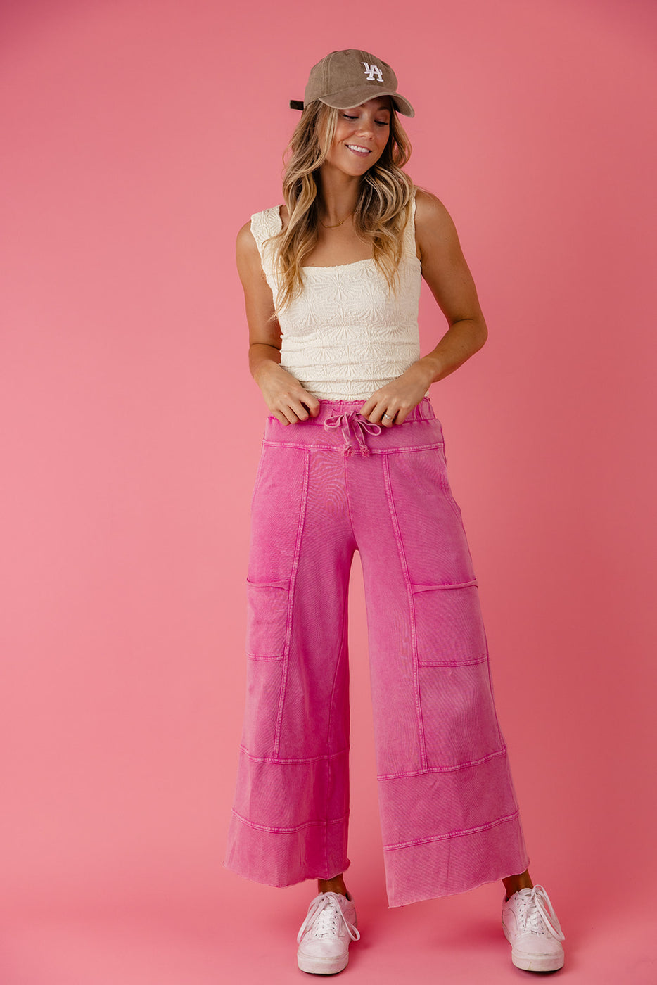 a woman in pink pants
