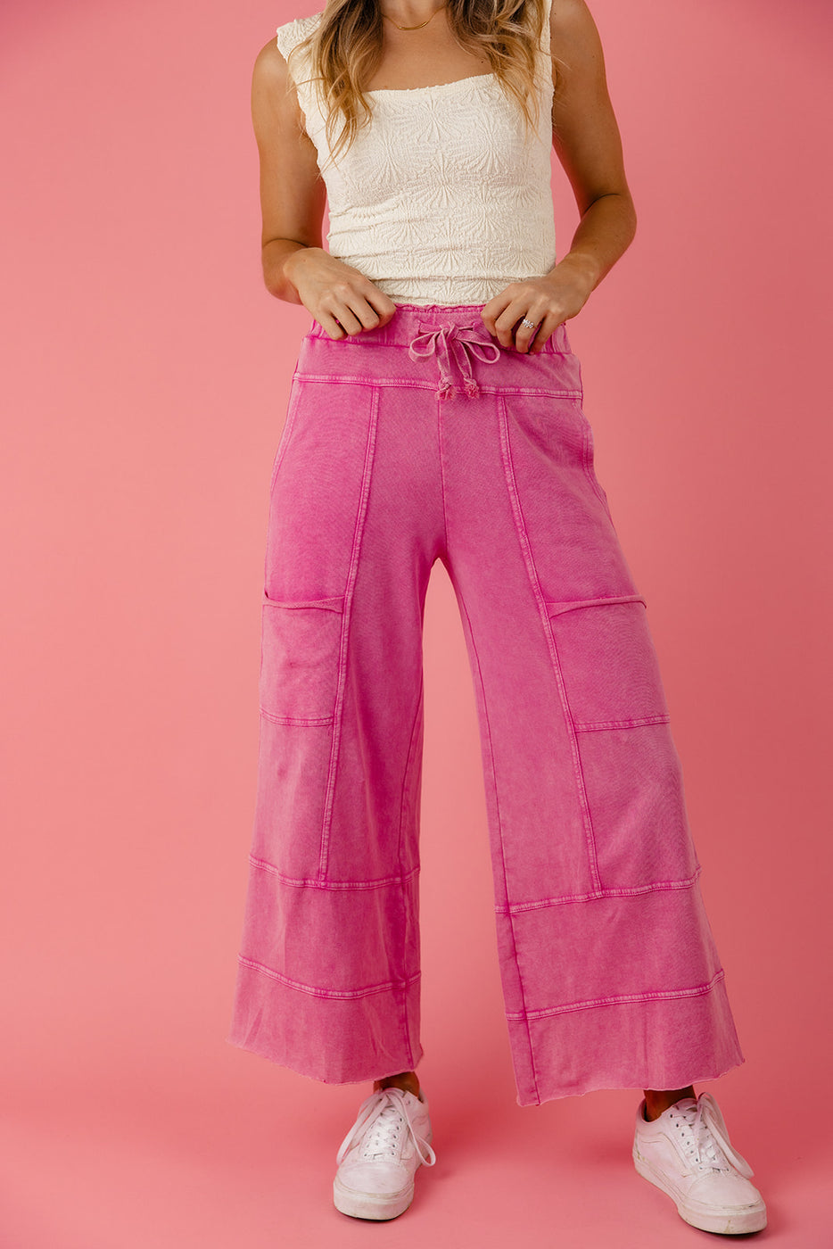 a woman wearing pink pants