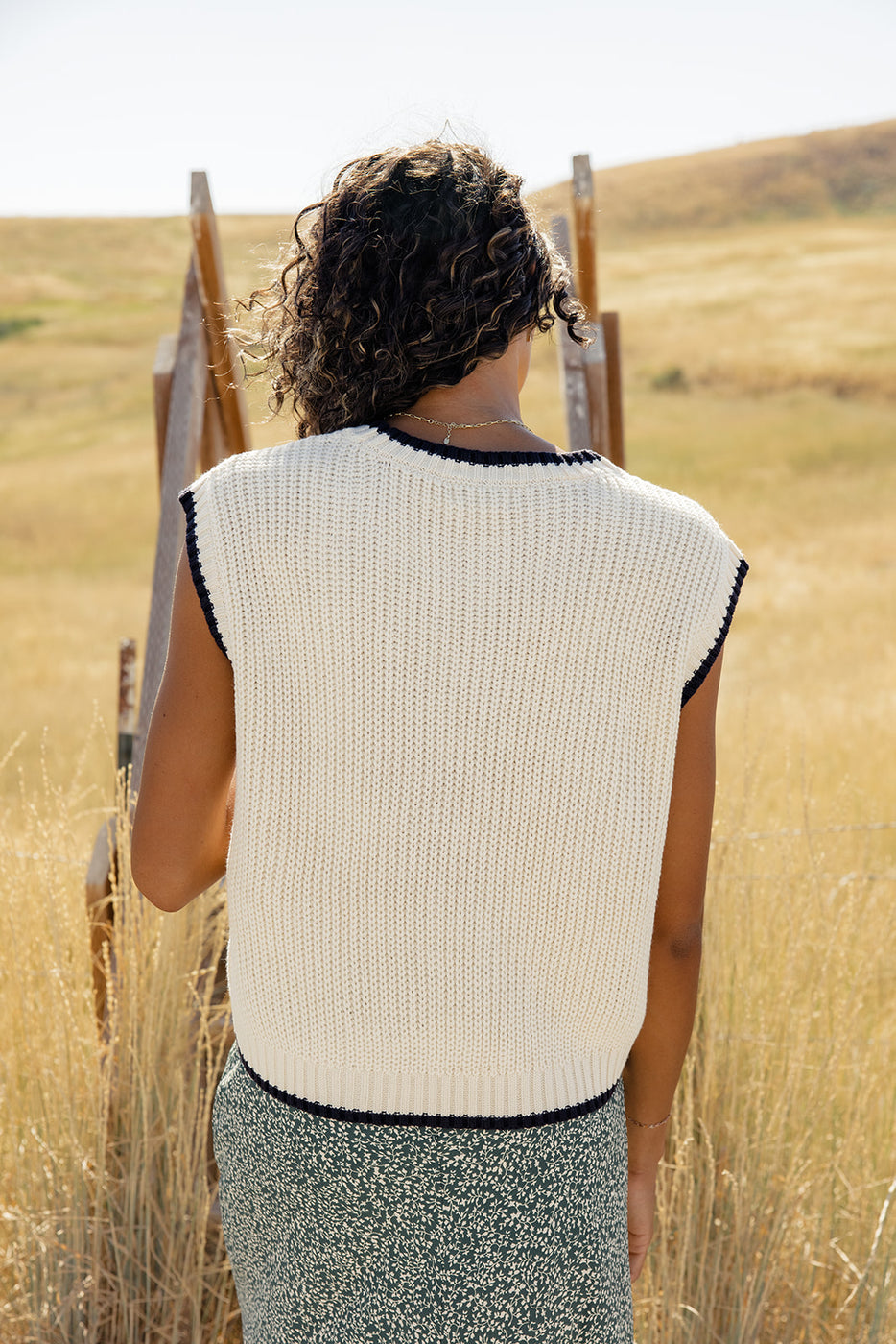 a woman standing in a field