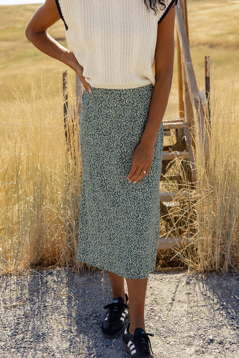 a woman standing in a field