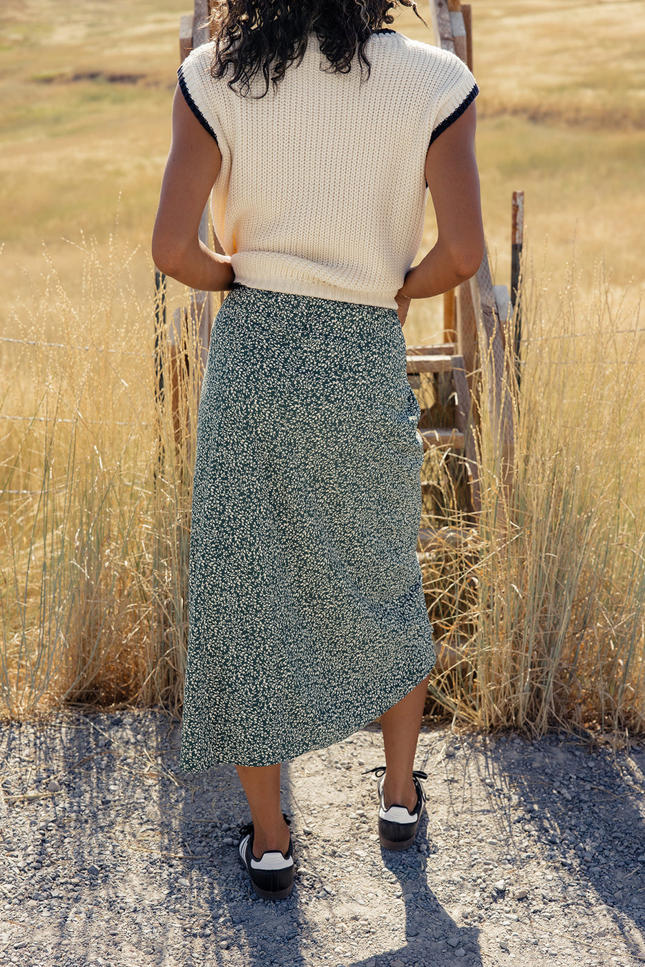 a woman standing in a field