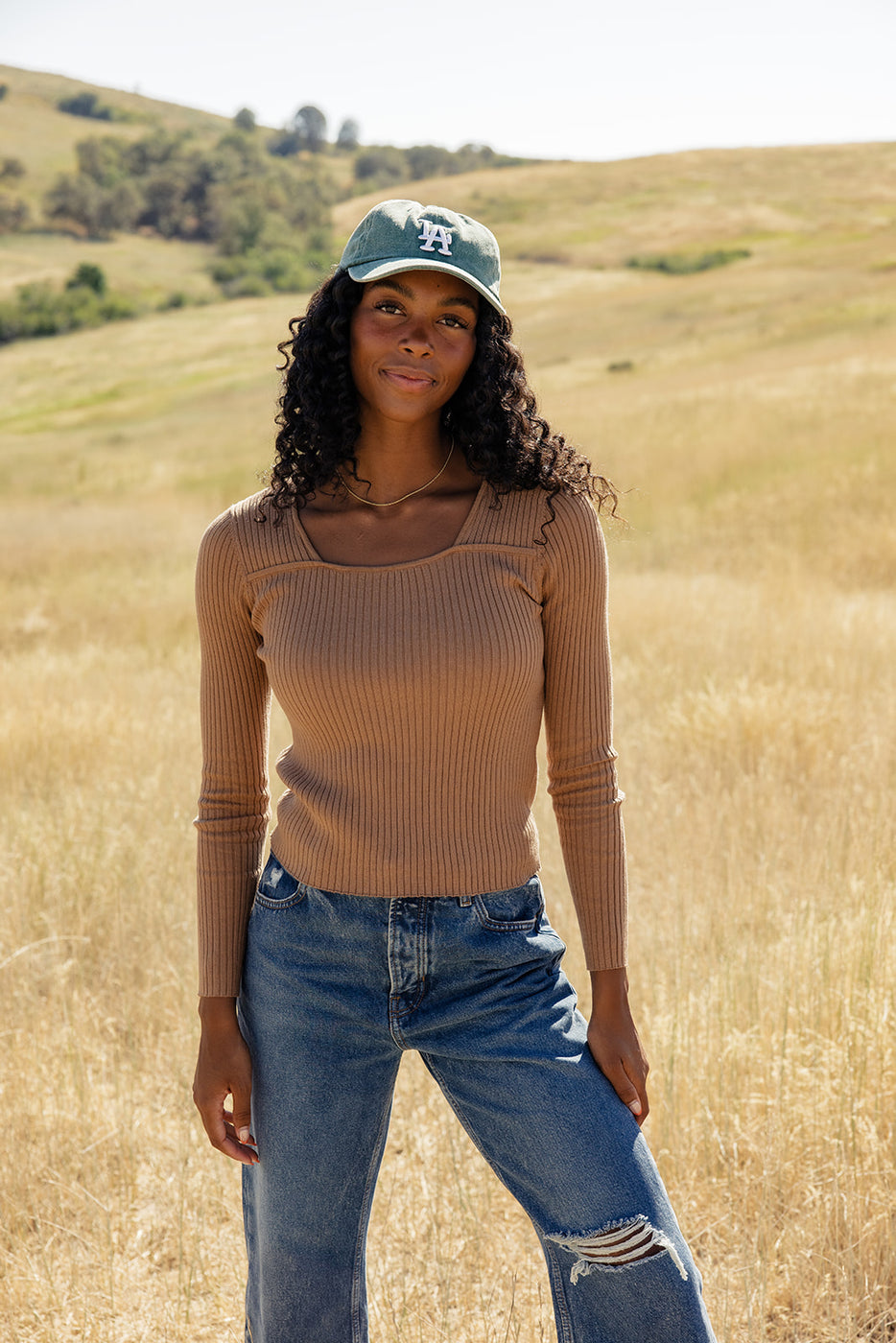 a woman standing in a field